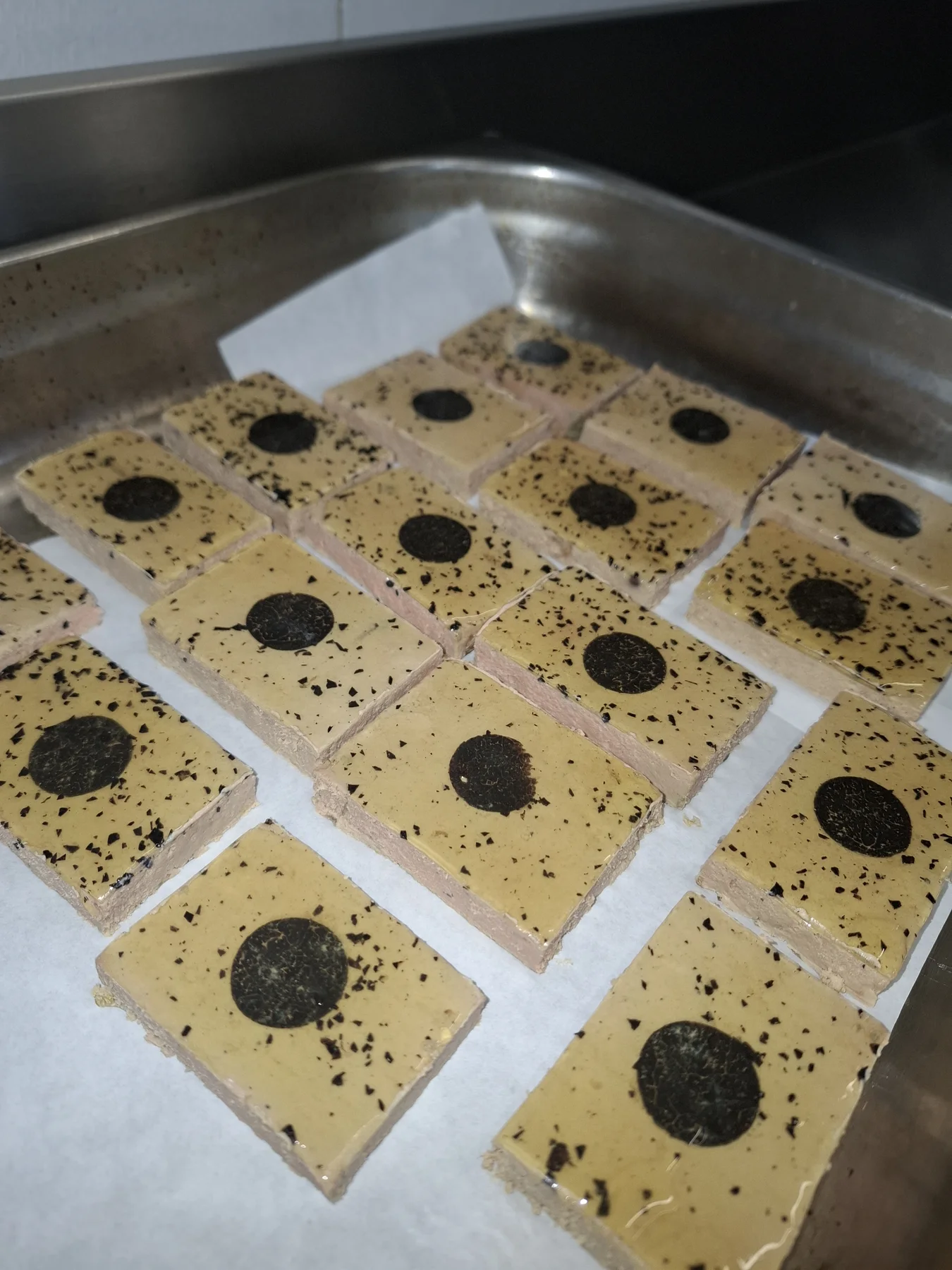 Duck terrine, black truffles, chicken consommé.