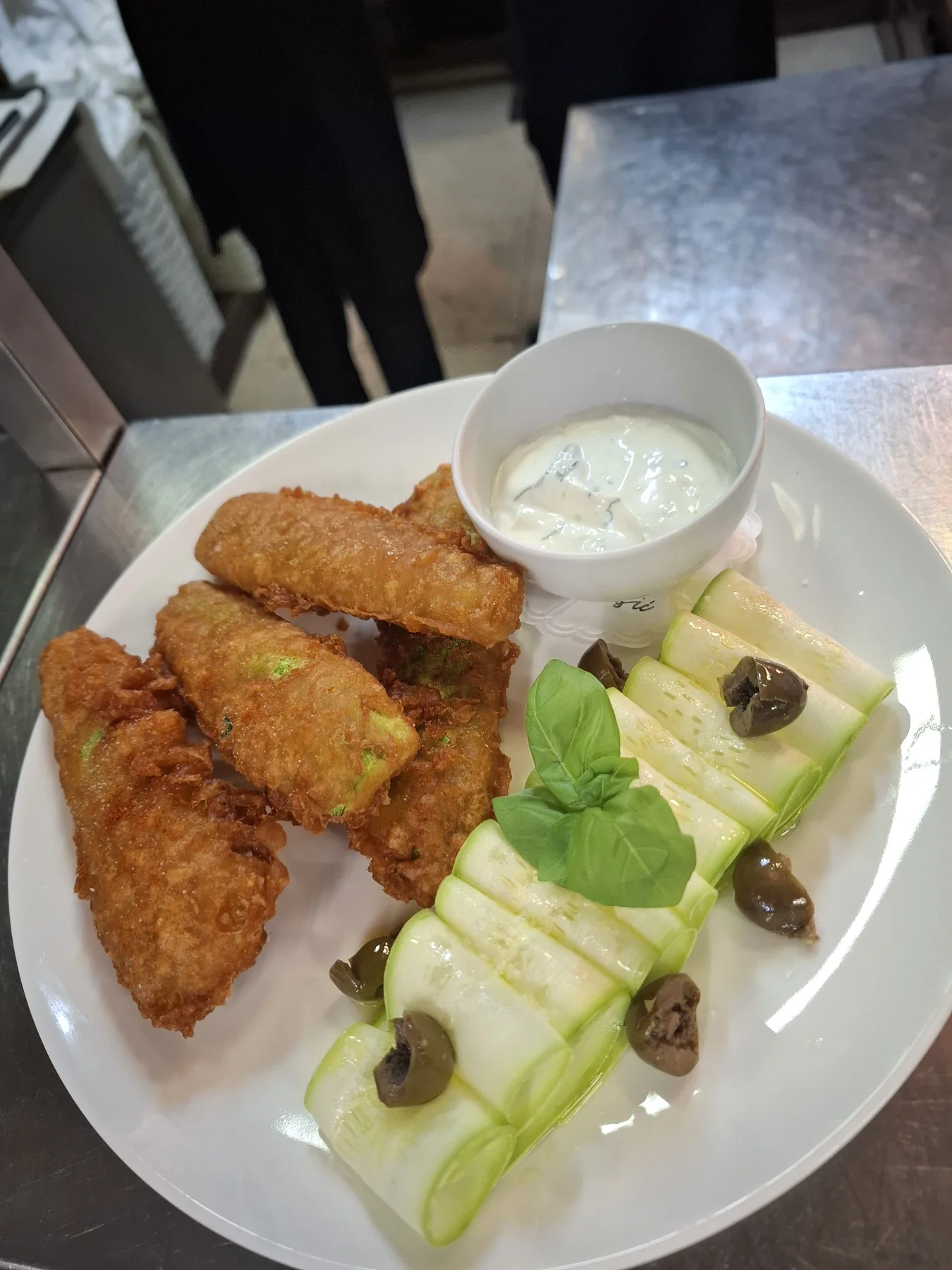 Courgette tempura, courgette salad, basil, tzatziki, olives.