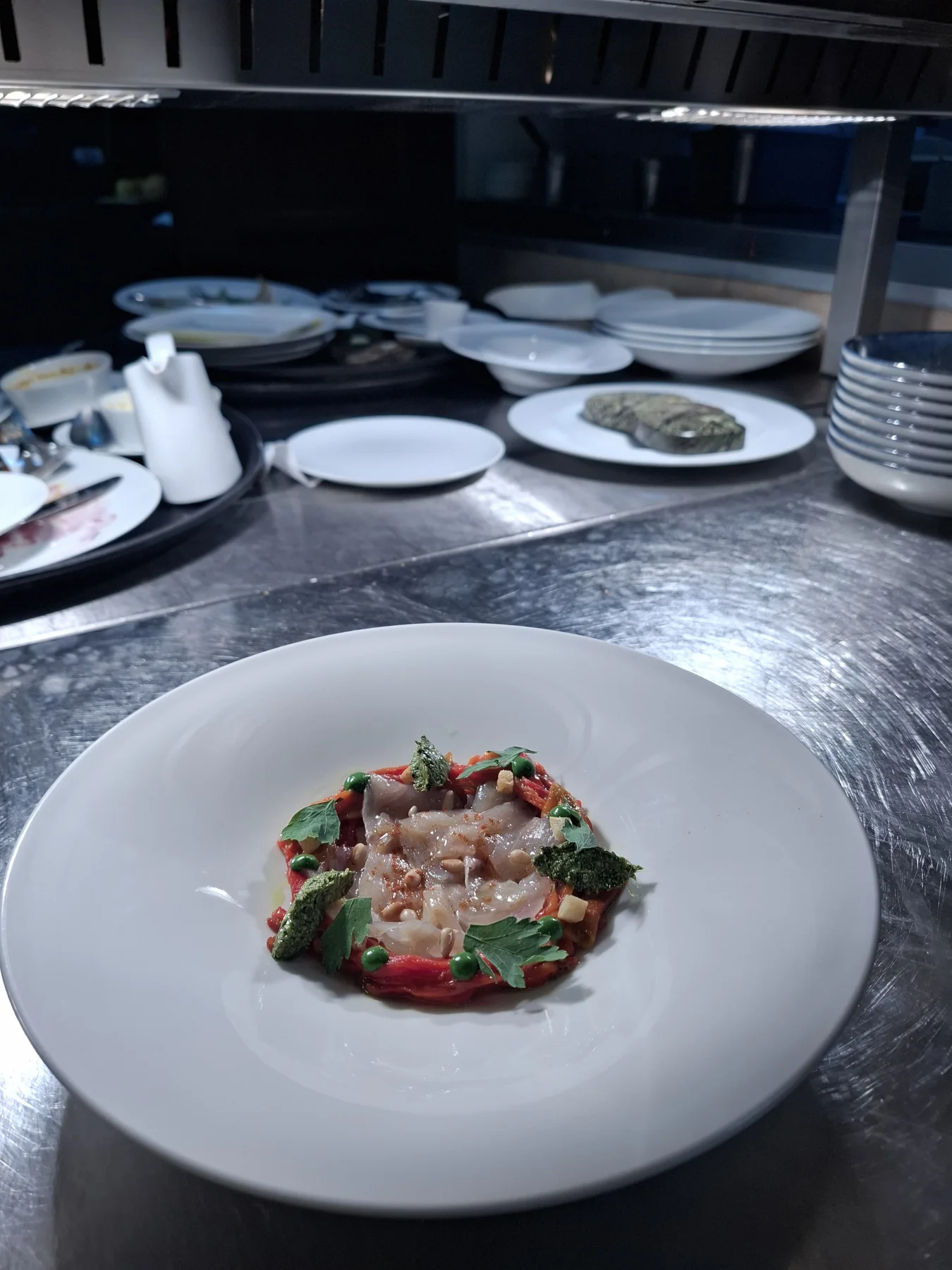 Trout gravlax, marinated peppers, wild garlic pesto, basil cream, parsley, pine nuts.