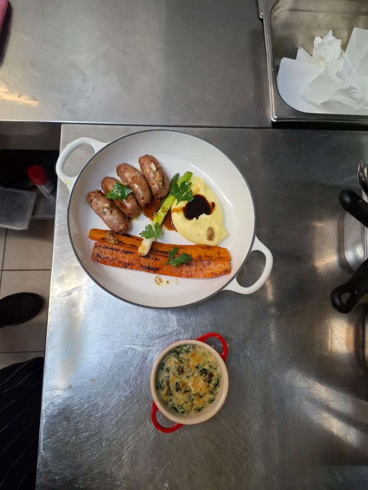 Veal sausages with lemon, carrots cooked in orange juice, mashed potatoes, creamy spinach with Parmesan.