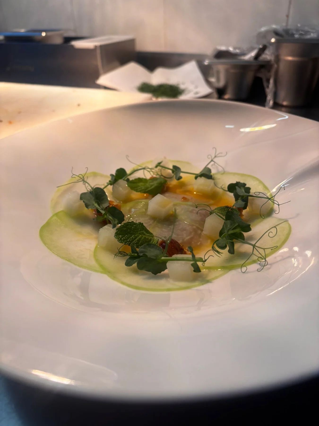 Blanched kohlrabi, lime and sesame oil dressing, caramelised walnuts, buckwheat, pea shoots.